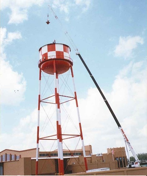 A crane adds the beacon to the water tower in 1995.