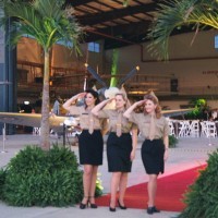 era inspired military airplane stewards posing on red carpet