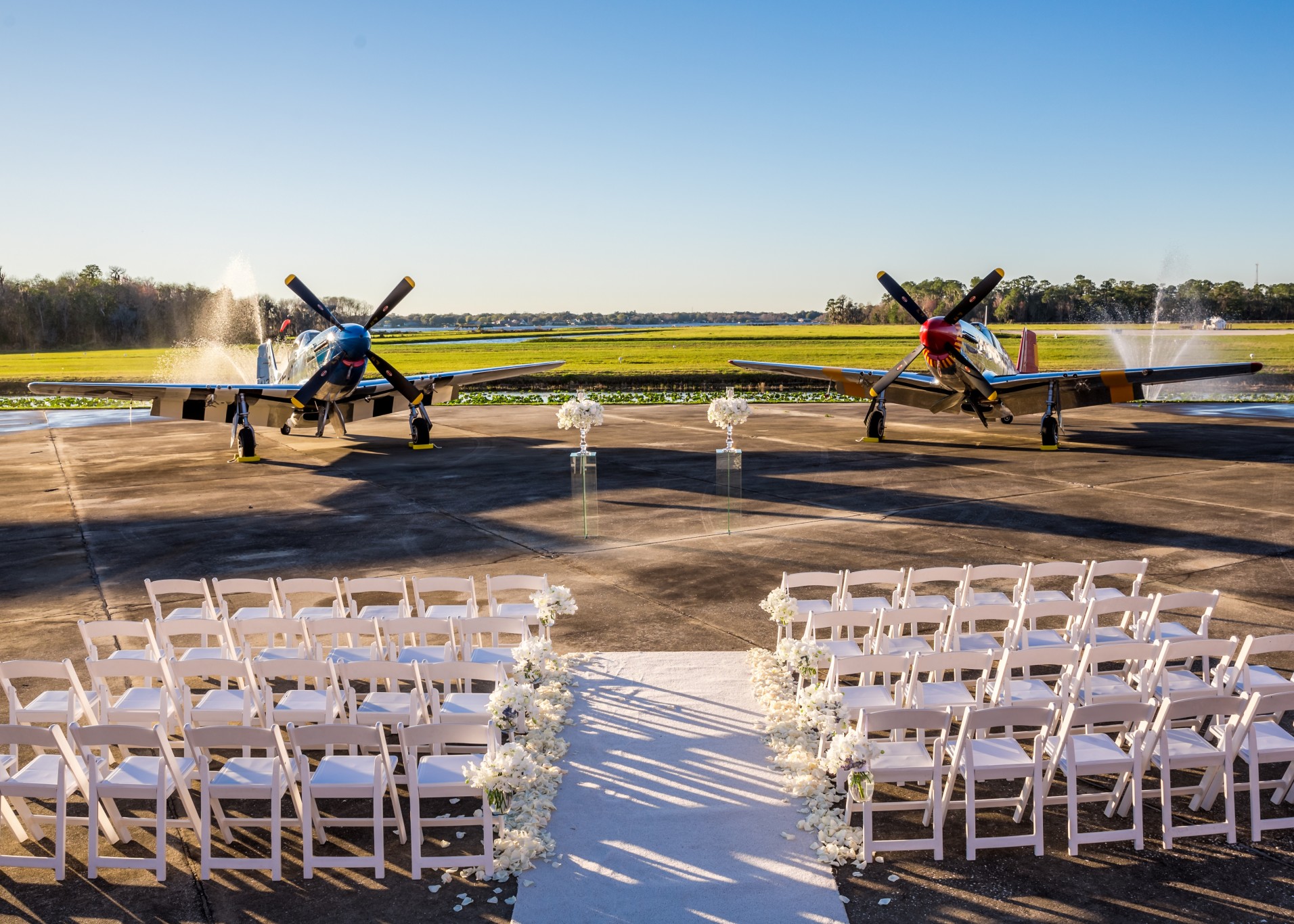 Two vintage fighter planes framing wedding alter at Fantasy of Flight
